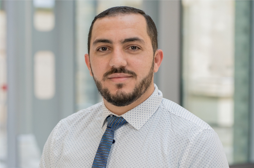 Person smiling at camera in professional image