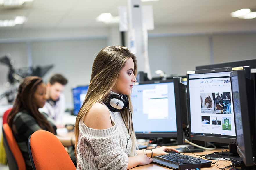 Student in newsroom