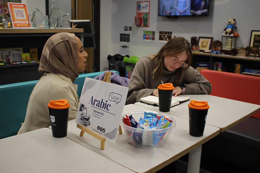 students at city global lounge for language cafe